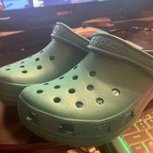 Turquoise Crocs barely used (wore once)
